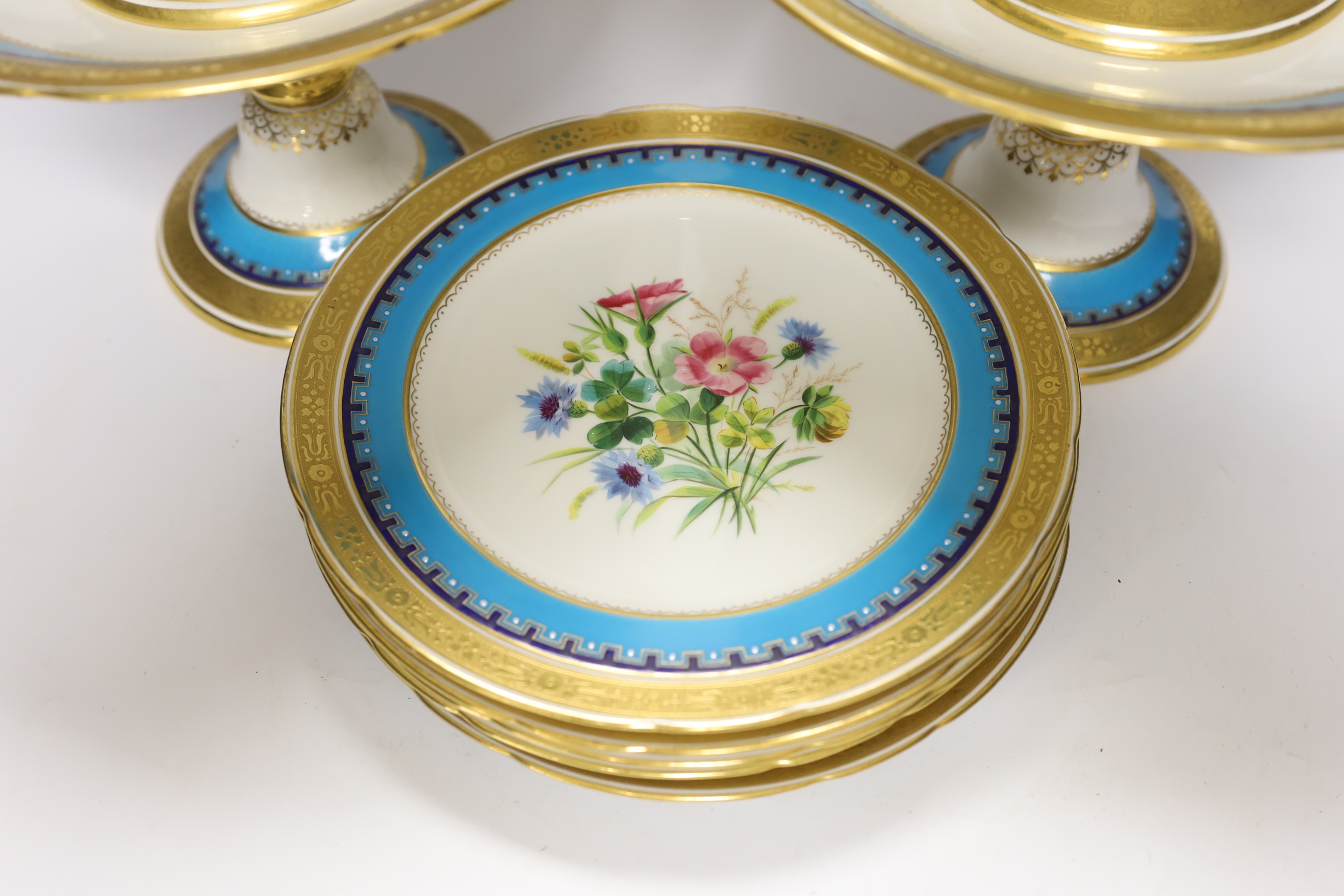 A 19th century Minton porcelain dessert service with gilt and floral decoration, twelve plates and two pairs of various height comports, tallest 16.5cm high